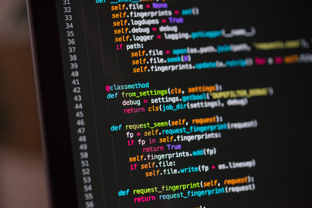 Colorful program code on a dark computer screen